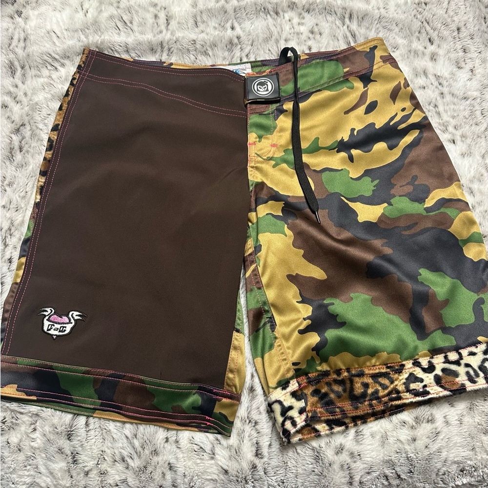 Fighter girl MMA board shorts. NWT size 9